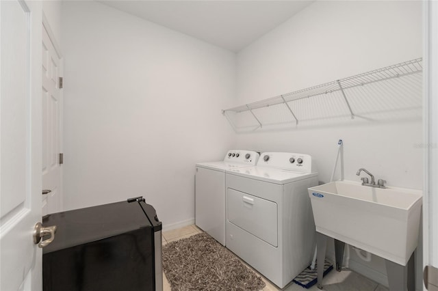 7571 SW 64th Street Rd, Ocala, FL 34474 - laundry room with separate washer and dryer and light tile patterned flooring