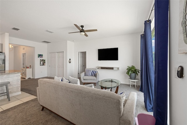 7571 SW 64th Street Rd, Ocala, FL 34474 - living room featuring a ceiling fan, light colored carpet, and light tile patterned floors