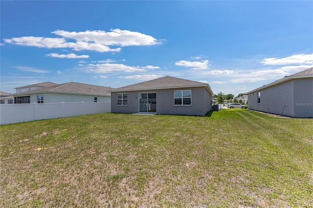 7571 SW 64th Street Rd, Ocala, FL 34474 - back of property featuring central AC and stucco siding