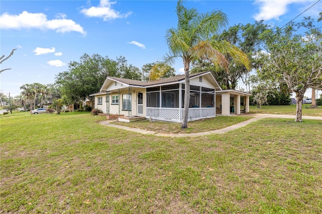 705 Washington Ave, Eustis, FL 32726 - view of front facade with a sunroom and a front yard