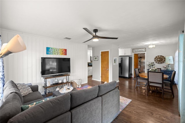 705 Washington Ave, Eustis, FL 32726 - living room with dark wood-style floors and a ceiling fan