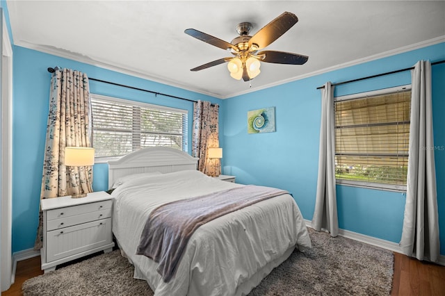 705 Washington Ave, Eustis, FL 32726 - bedroom with ornamental molding, wood finished floors, baseboards, and a ceiling fan