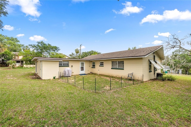 705 Washington Ave, Eustis, FL 32726 - rear view of property featuring a lawn