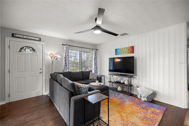 705 Washington Ave, Eustis, FL 32726 - living area featuring dark wood-type flooring, a ceiling fan, and baseboards