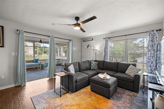 705 Washington Ave, Eustis, FL 32726 - living room featuring a ceiling fan, wood finished floors, and baseboards