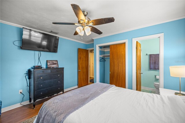 705 Washington Ave, Eustis, FL 32726 - bedroom featuring a closet, wood finished floors, crown molding, baseboards, and ceiling fan