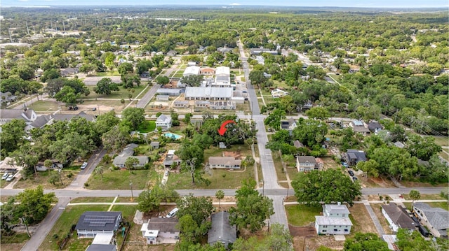 705 Washington Ave, Eustis, FL 32726 - aerial overview of property's location featuring nearby suburban area and a heavily wooded area
