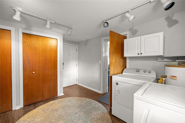 705 Washington Ave, Eustis, FL 32726 - laundry area featuring track lighting, water heater, washer and clothes dryer, dark wood finished floors, and a textured ceiling