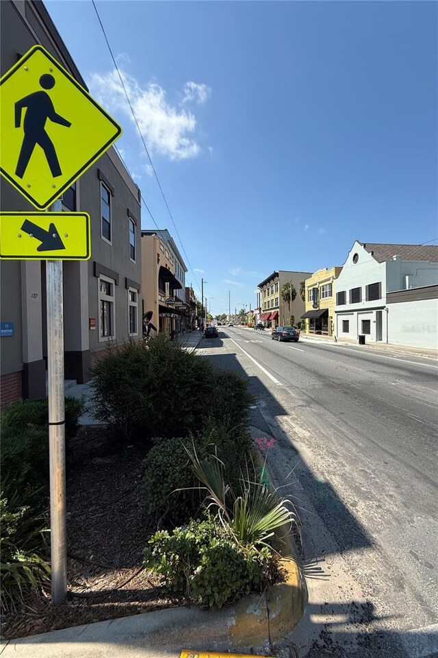 705 Washington Ave, Eustis, FL 32726 - view of asphalt street featuring a residential view and sidewalks