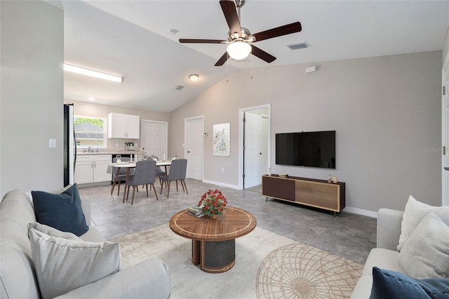 20443 SW Rainbow Lakes Blvd, Dunnellon, FL 34431 - living room with a ceiling fan, lofted ceiling, and baseboards