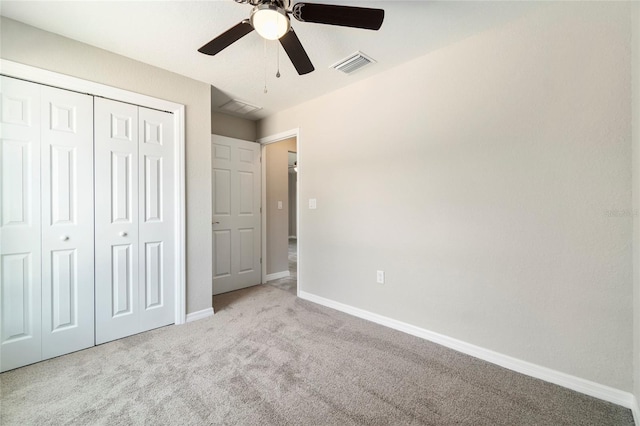 20443 SW Rainbow Lakes Blvd, Dunnellon, FL 34431 - unfurnished bedroom featuring carpet flooring, baseboards, a closet, and ceiling fan
