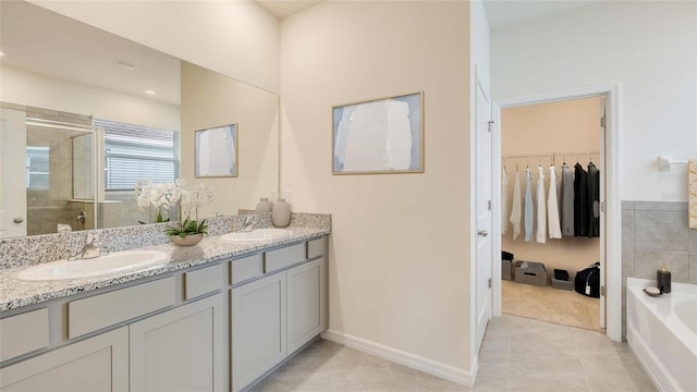 12791 NW 13th Ln, Newberry, FL 32669 - full bath featuring double vanity, tile patterned floors, a stall shower, a walk in closet, and a bath