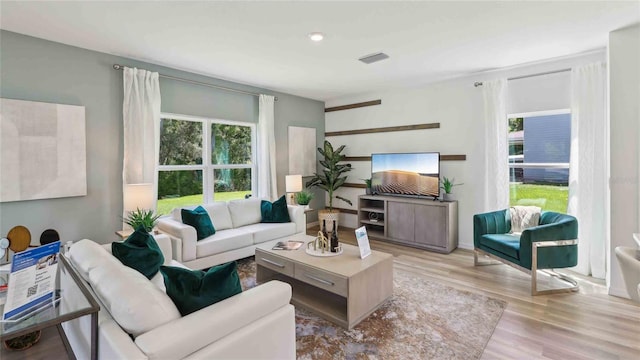 4937 SW 51st Rd, Gainesville, FL 32608 - living room featuring plenty of natural light and wood finished floors