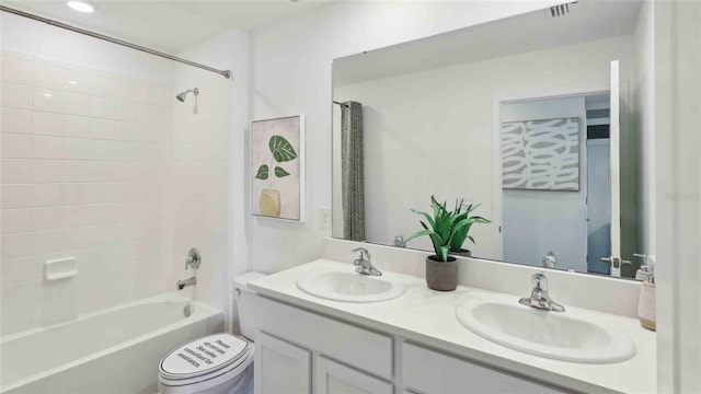 4937 SW 51st Rd, Gainesville, FL 32608 - bathroom featuring double vanity, toilet, and shower / washtub combination