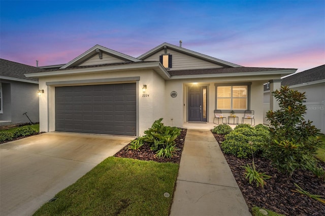 7224 SW 61st Pl, Ocala, FL 34474 - ranch-style home with covered porch, an attached garage, concrete driveway, stucco siding, and a shingled roof