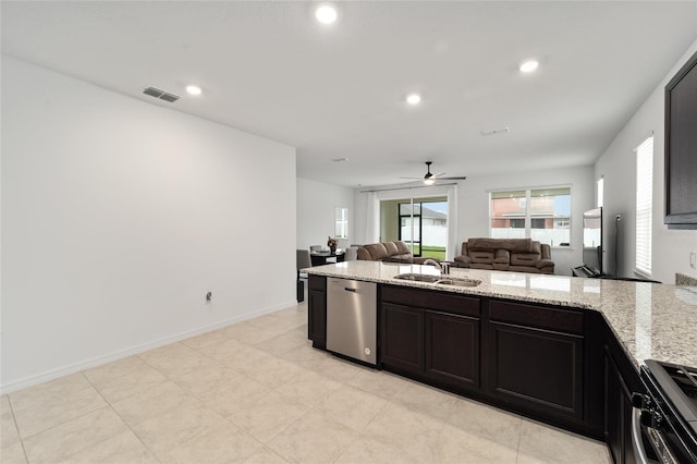 7224 SW 61st Pl, Ocala, FL 34474 - kitchen featuring stainless steel appliances, a sink, ceiling fan, open floor plan, and light stone counters