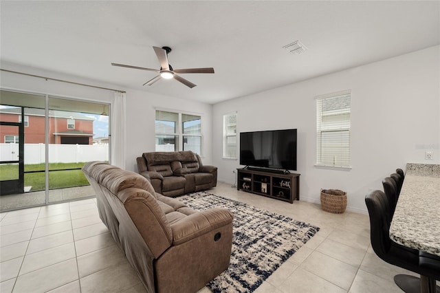 7224 SW 61st Pl, Ocala, FL 34474 - tiled living room featuring a ceiling fan and baseboards