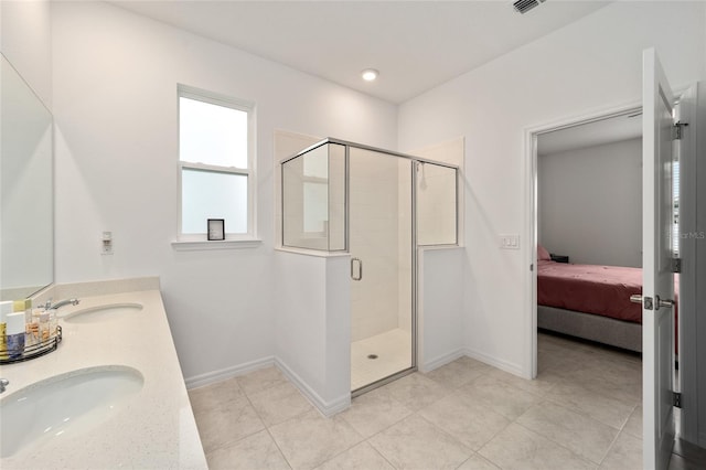7224 SW 61st Pl, Ocala, FL 34474 - full bathroom with ensuite bath, double vanity, a stall shower, baseboards, and tile patterned floors