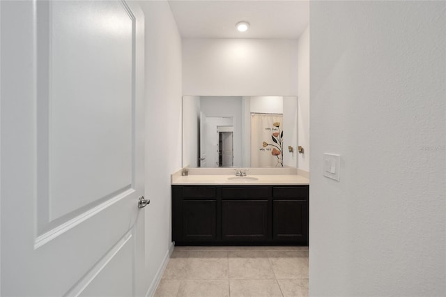 7224 SW 61st Pl, Ocala, FL 34474 - bathroom with vanity, tile patterned flooring, and baseboards