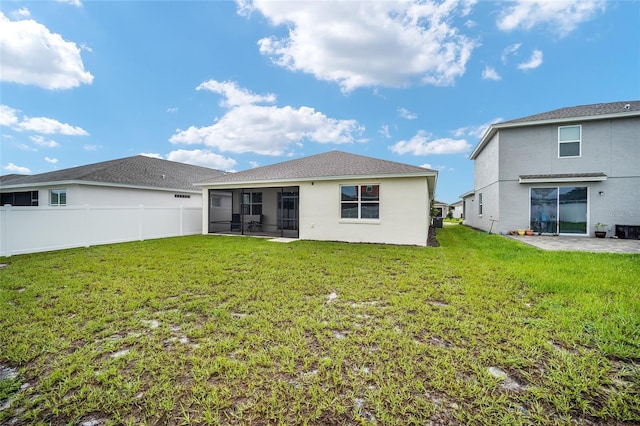 7224 SW 61st Pl, Ocala, FL 34474 - rear view of house with a sunroom, stucco siding, and a patio area
