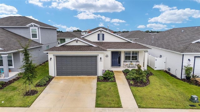 7224 SW 61st Pl, Ocala, FL 34474 - traditional-style house featuring a garage, a shingled roof, a porch, and stucco siding