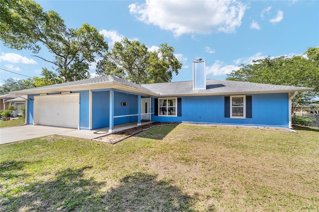 11 SE Fir Trail Trak, Ocala, FL 34472 - ranch-style house featuring an attached garage, a chimney, driveway, and a front lawn