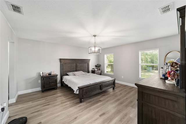 11 SE Fir Trail Trak, Ocala, FL 34472 - bedroom with light wood-style floors and baseboards