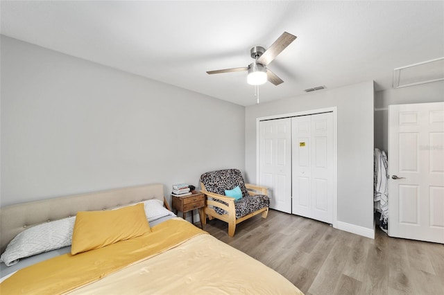 11 SE Fir Trail Trak, Ocala, FL 34472 - bedroom with a closet, wood finished floors, a ceiling fan, and baseboards