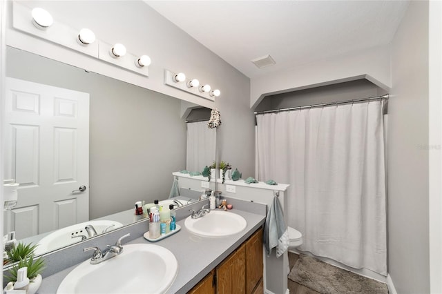 11 SE Fir Trail Trak, Ocala, FL 34472 - full bathroom featuring double vanity, toilet, and a shower with curtain