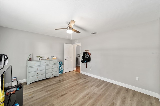 11 SE Fir Trail Trak, Ocala, FL 34472 - bedroom with light wood-style flooring, baseboards, and a ceiling fan