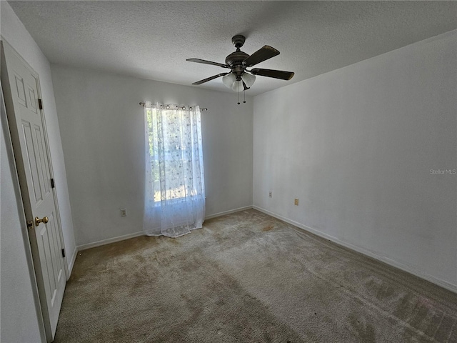 18 Fir Trail Dr, Ocala, FL 34472 - carpeted empty room featuring a ceiling fan, a textured ceiling, and baseboards