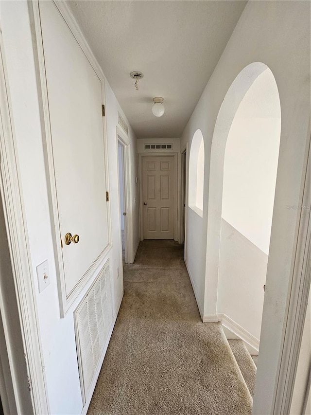18 Fir Trail Dr, Ocala, FL 34472 - corridor with light colored carpet and baseboards