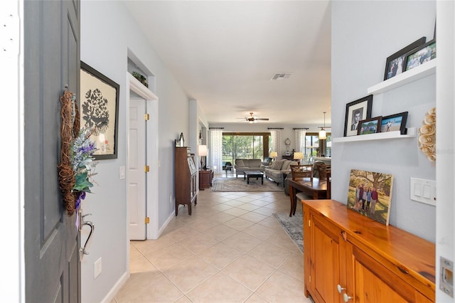 7333 SW 98th Ct, Ocala, FL 34481 - hallway featuring light tile patterned floors and baseboards