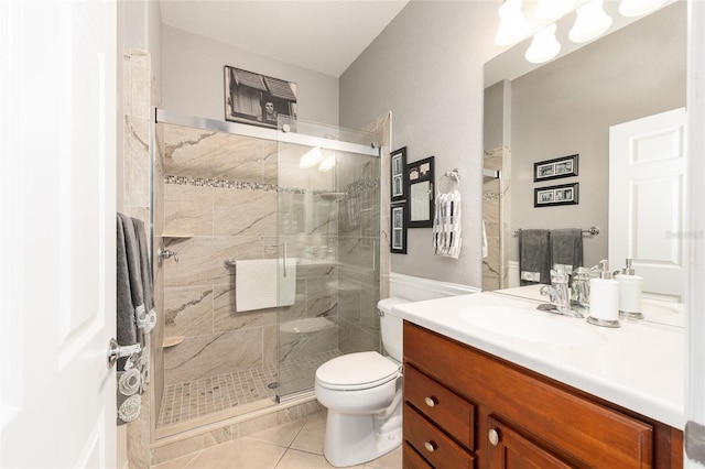 7333 SW 98th Ct, Ocala, FL 34481 - bathroom featuring vanity, tile patterned floors, a stall shower, and toilet