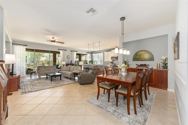 7333 SW 98th Ct, Ocala, FL 34481 - dining room with light tile patterned floors and ceiling fan