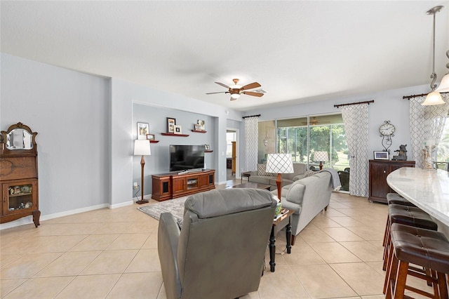 7333 SW 98th Ct, Ocala, FL 34481 - living area with ceiling fan, light tile patterned flooring, and baseboards
