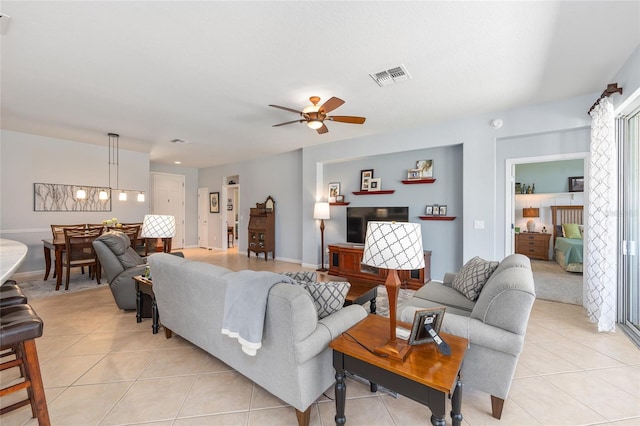 7333 SW 98th Ct, Ocala, FL 34481 - living room featuring light tile patterned floors, ceiling fan, and baseboards