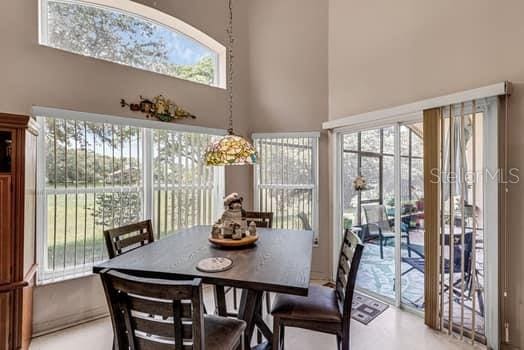 2434 Walnut Heights Rd, Apopka, FL 32703 - dining space featuring a high ceiling