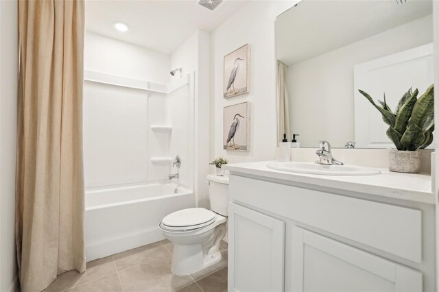 2153 NE 28th Ln, Ocala, FL 34470 - full bath with tile patterned flooring, toilet, vanity, and shower / bath combo with shower curtain
