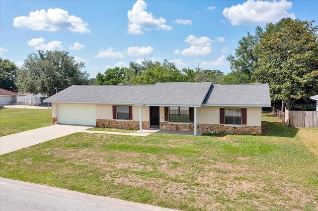 4331 SE 106th Pl, Belleview, FL 34420 - single story home with stone siding, concrete driveway, an attached garage, and a shingled roof