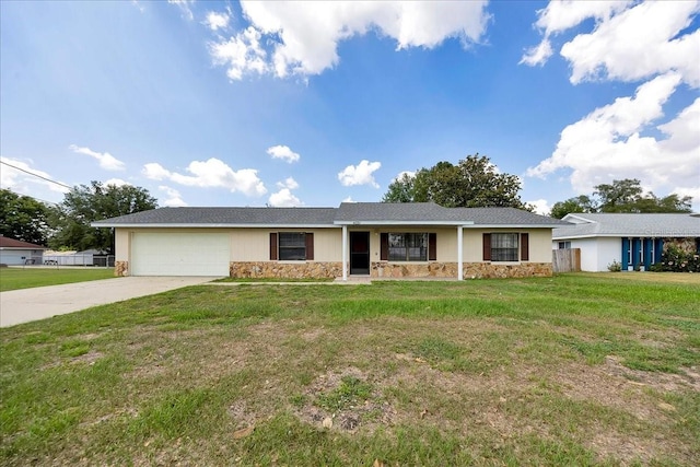 4331 SE 106th Pl, Belleview, FL 34420 - single story home featuring stone siding, a garage, concrete driveway, and a front lawn