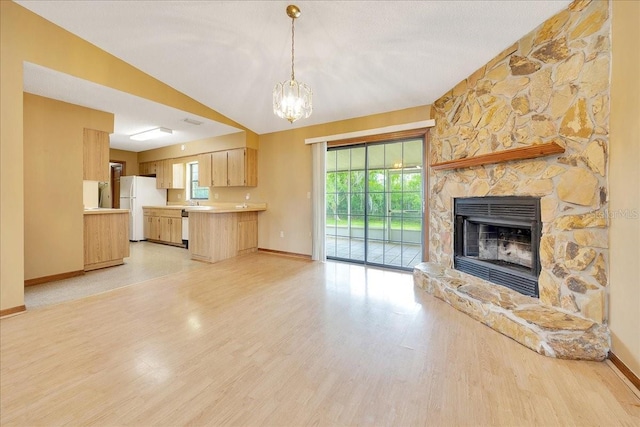 4331 SE 106th Pl, Belleview, FL 34420 - unfurnished living room with baseboards, light wood-style floors, and a chandelier