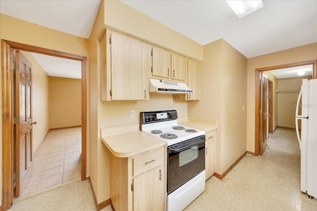 4331 SE 106th Pl, Belleview, FL 34420 - kitchen with white appliances, under cabinet range hood, a textured ceiling, light countertops, and baseboards