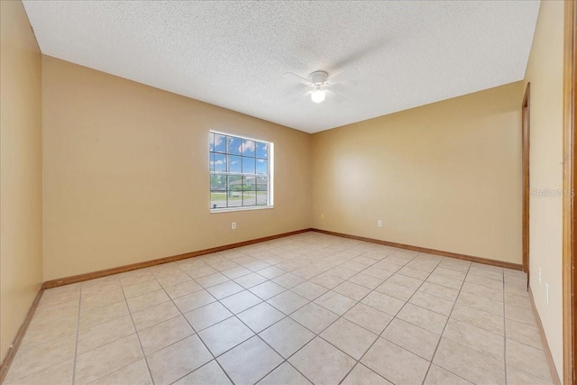 4331 SE 106th Pl, Belleview, FL 34420 - unfurnished room with a ceiling fan, a textured ceiling, baseboards, and light tile patterned floors