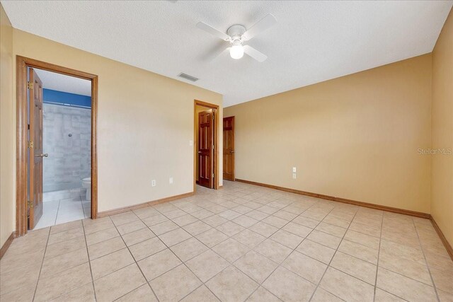 4331 SE 106th Pl, Belleview, FL 34420 - unfurnished room with a ceiling fan, light tile patterned floors, baseboards, and a textured ceiling