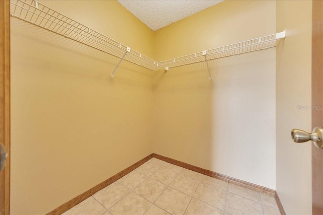 4331 SE 106th Pl, Belleview, FL 34420 - walk in closet with light tile patterned flooring