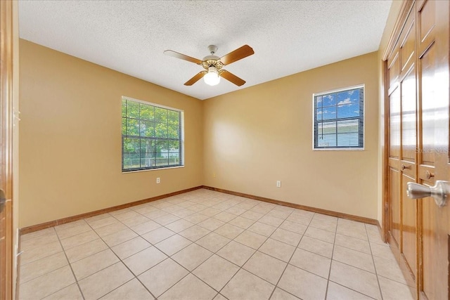 4331 SE 106th Pl, Belleview, FL 34420 - unfurnished room with a textured ceiling, ceiling fan, and baseboards