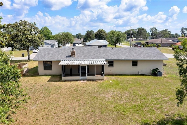 4331 SE 106th Pl, Belleview, FL 34420 - back of house featuring a sunroom, roof with shingles, stucco siding, and a residential view