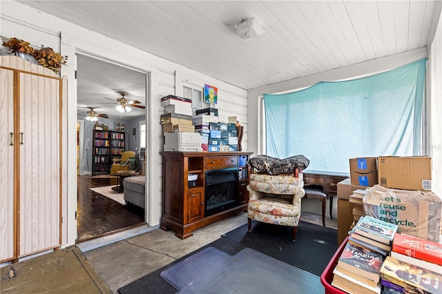 1405 NE 55th St, Ocala, FL 34479 - living area featuring unfinished concrete flooring, ceiling fan, and plenty of natural light