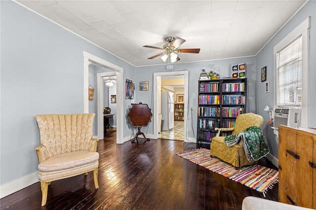1405 NE 55th St, Ocala, FL 34479 - sitting room featuring a ceiling fan, hardwood / wood-style flooring, crown molding, baseboards, and cooling unit